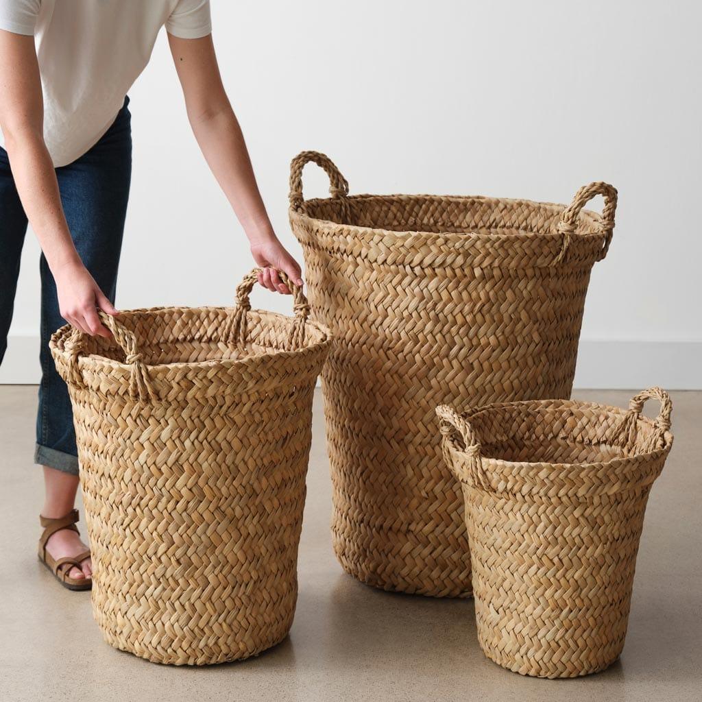 Storage basket being lifted by someone